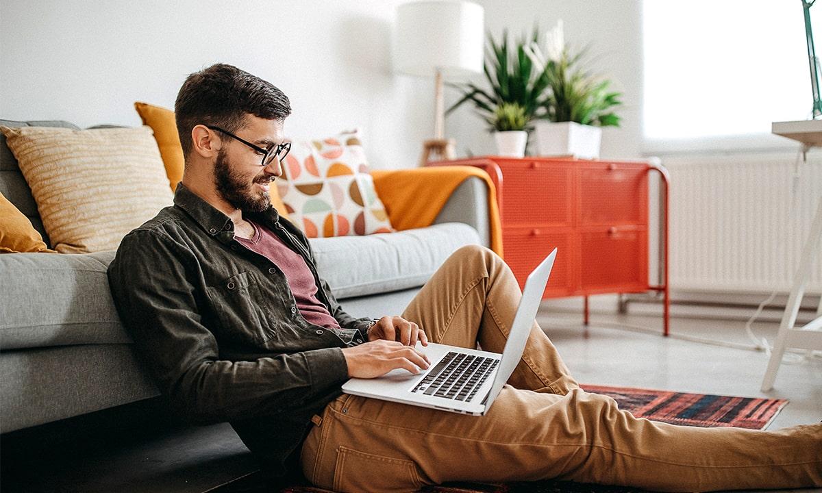 Male engineer on his computer connects with his remote team through Terminal