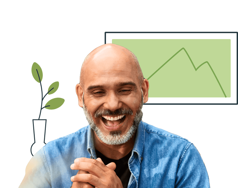 Man smiling with a plant and dashboard behind him
